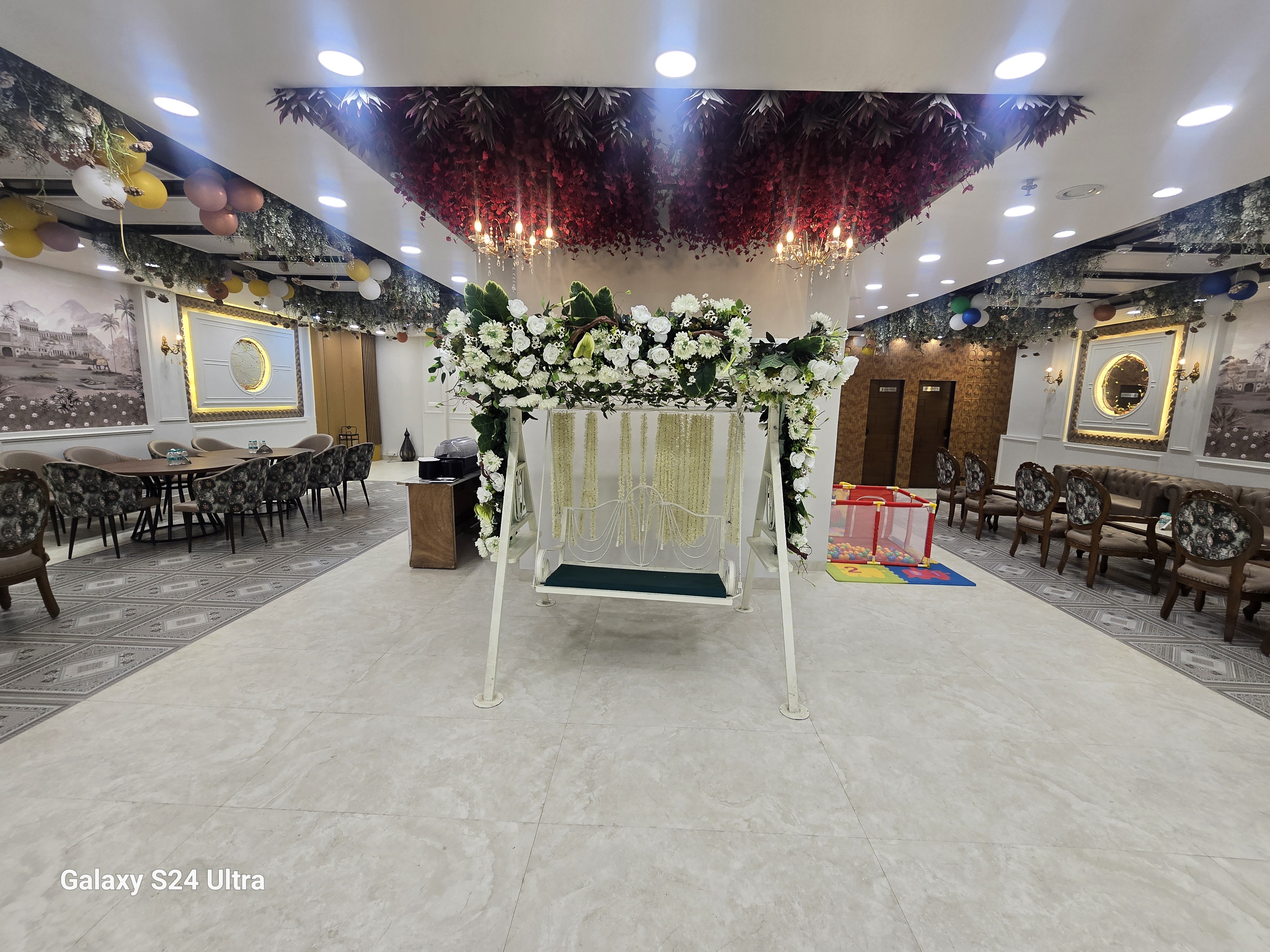 Spacious Erish Banquet hall with floral swing decor and kids play area